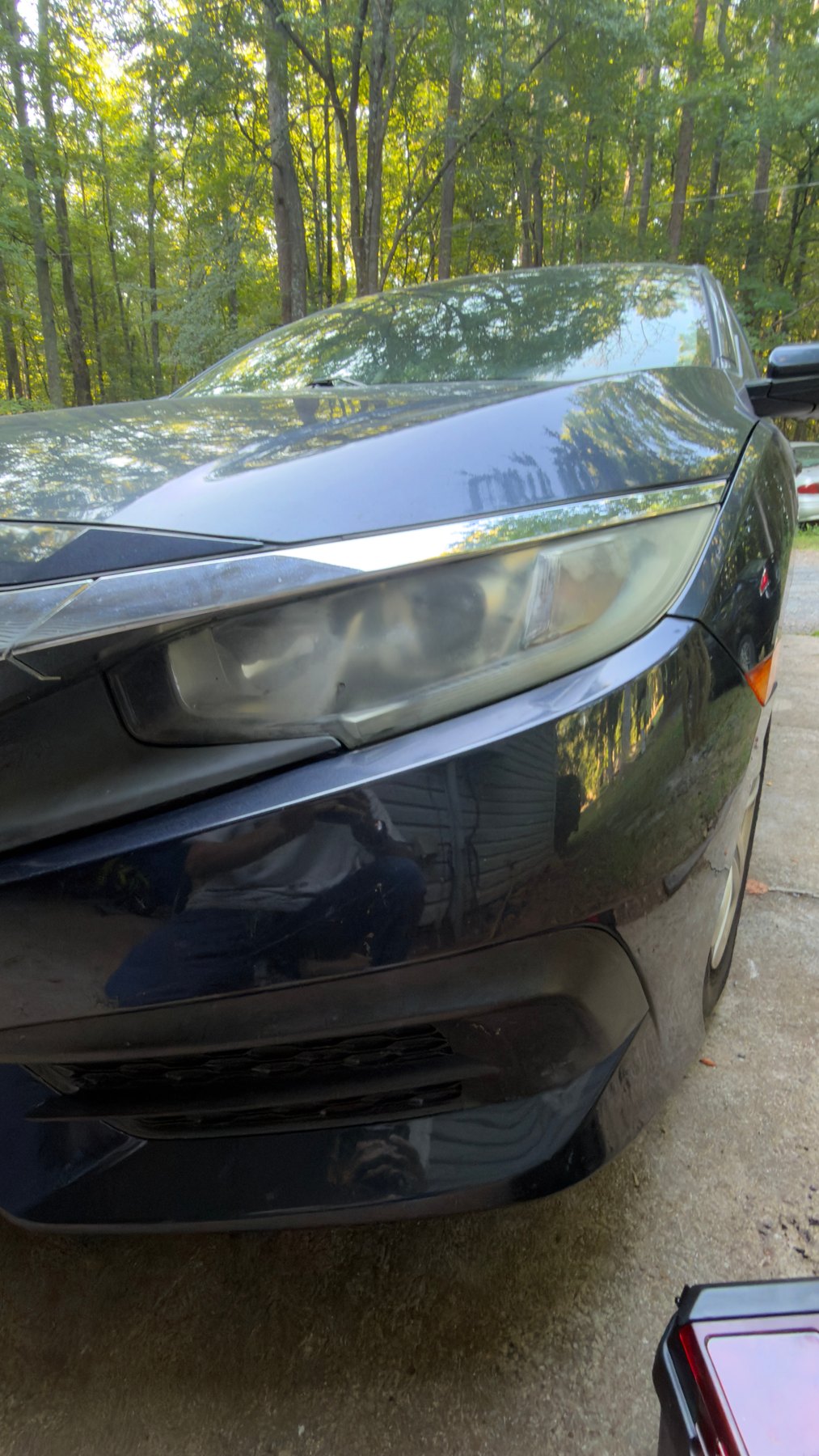 Cloudy Honda Civic headlight before restoration